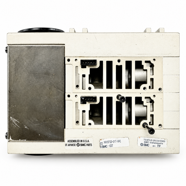 SMC NVV5FS3-01T-041-03T manifold with exposed mounting faces and original terminal cover — representative studio image